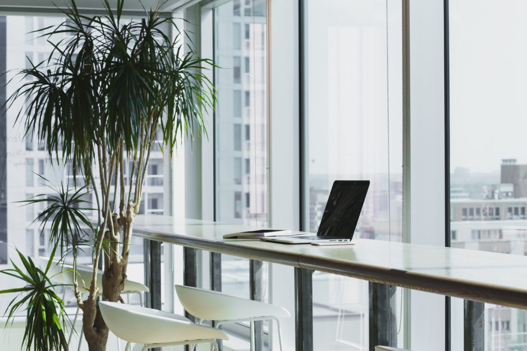 Laptop on a desk in a white office